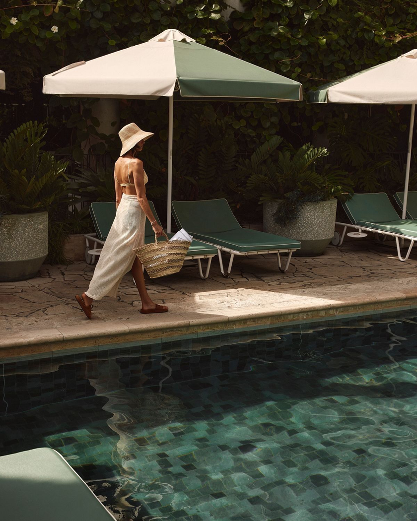 Poolside relaxation image extracted from the brochure